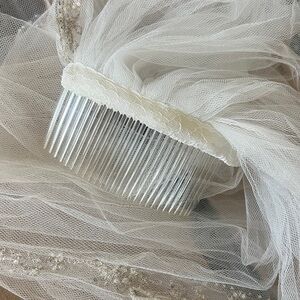 Elegant White Bridal Veil with Beaded Details plus bridal sleeves and flowers